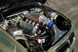 Under the hood of the E92 Eurofighter, which features a custom AEM® Intakes panel filter